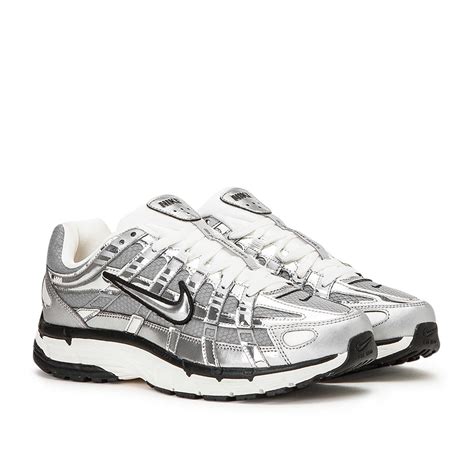 white and silver nike sneakers.